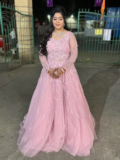The full view of the bride-to-be in her beautiful pink engagement gown.