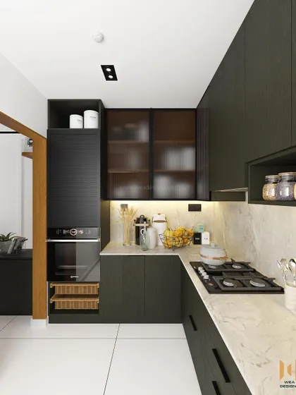 The kitchen for our Nano Home project, featuring a dark green laminate finish, black fluted glass cabinets, and a marble-textured quartz countertop.