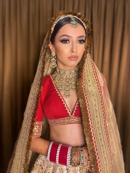 A regal pose that captures the essence of a modern maharani. Pawlin's makeup, with its strong contour and defined eyes, was designed to be powerful and photogenic.