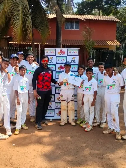 The team celebrating Mayur Shetty's 'Best Bowler' award in the MI Junior U-14 tournament.
