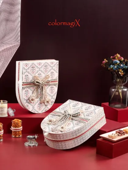 A closed view of our elegant oval gift boxes, highlighting the detailed craftsmanship of the packaging. These are designed to be keepsakes long after the treats are gone.