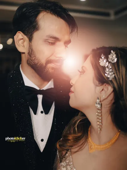 A romantic close-up of a couple, their faces illuminated by a soft light, capturing the deep connection and love between them.