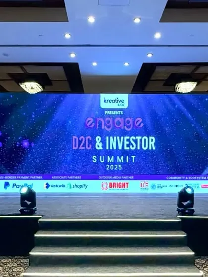 For the Engage D2C & Investor Summit, I designed a stage that was clean, professional, and tech-forward. The setup included a wide central LED wall for main presentations, flanked by branded screens and professional stage lighting to keep the focus on the speakers.