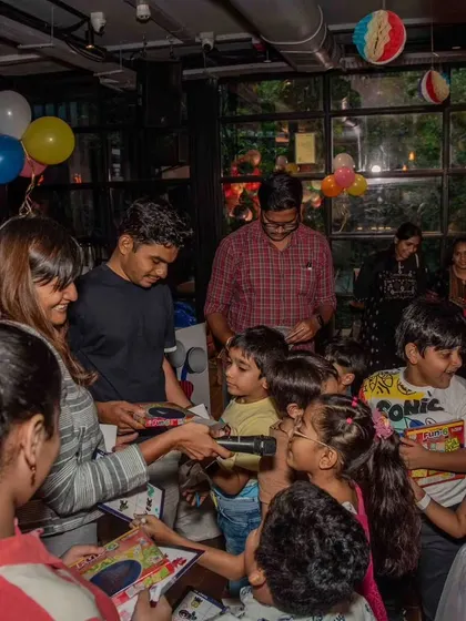 The celebration continues with prize distribution. After a session of building and experimenting, we love celebrating the kids' hard work and curiosity with fun, science-themed rewards.
