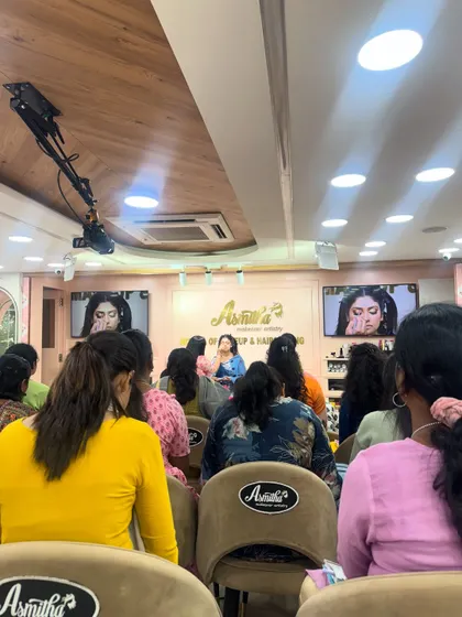 A wide view of our classroom during a live demo. Every student has a clear view of the techniques being taught on stage.