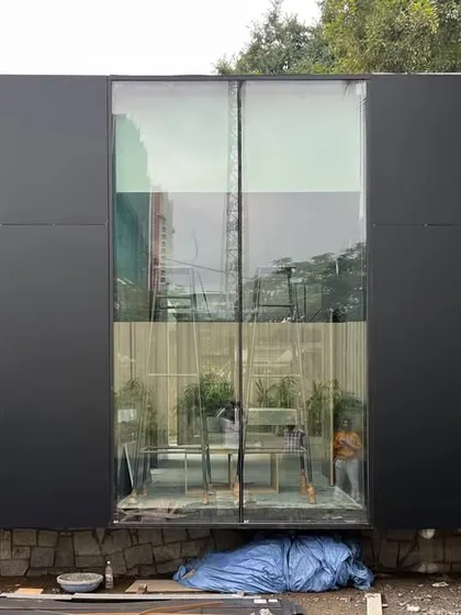 The rear facade of the VPG Centre, showing the contrast between the solid black panels and the transparent glass. This minimalist composition is a core part of our design philosophy.