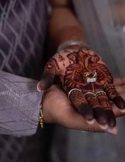 The moment he puts a ring on it. The rich stain of her engagement mehendi makes this shot even more special.