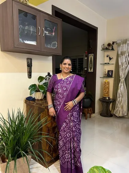 Latha is dazzling in this stunning purple saree, radiating confidence and grace. Purple symbolizes ambition and power, a perfect choice for a celebration.