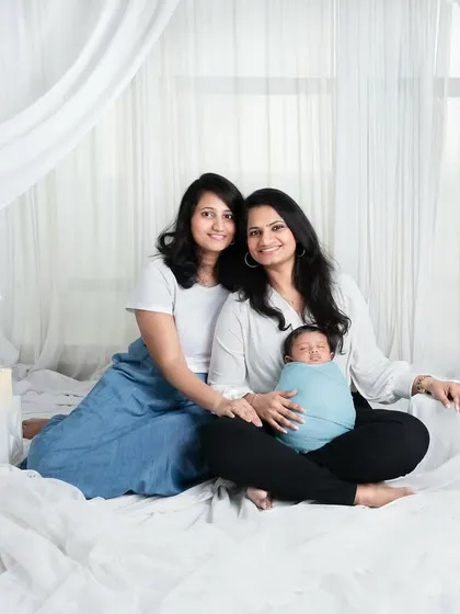 Cousins are our first friends. This lovely shot captures the bond between cousins as they welcome the newest member of the family.