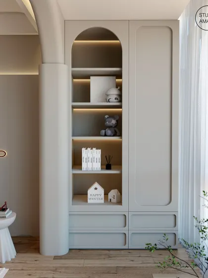 A conceptual design detail showing an arched, built-in shelving unit. We explore how architectural forms can be integrated into cabinetry to create storage that is both beautiful and unique, with soft backlighting to highlight decorative objects.