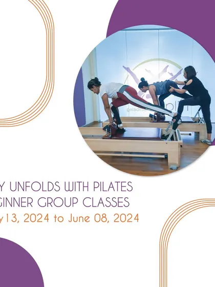 Our beginner group classes are a great way to start your journey. This image shows a class in session, with an instructor providing hands-on correction to ensure proper form and safety.