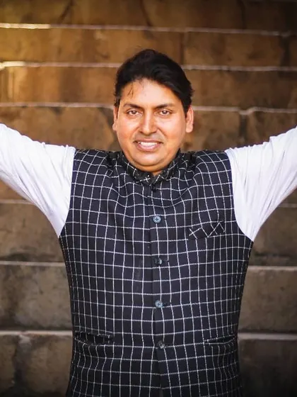 A welcoming pose. My goal as a magician is to open the door to a world of imagination and fun for my audience.