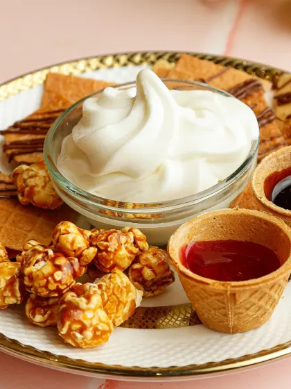 A close-up of our unique Nachos Ice Cream platter. This interactive dessert allows guests to create their own perfect bite, combining crunchy, creamy, sweet, and salty elements.
