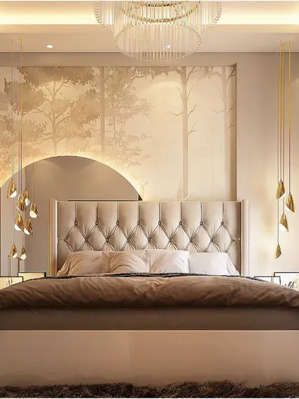Soft and dreamy, this bedroom features a tufted cream headboard set against a mural of a misty forest. The large circular mirror and cascading pendant lights add a touch of modern elegance and glamour.
