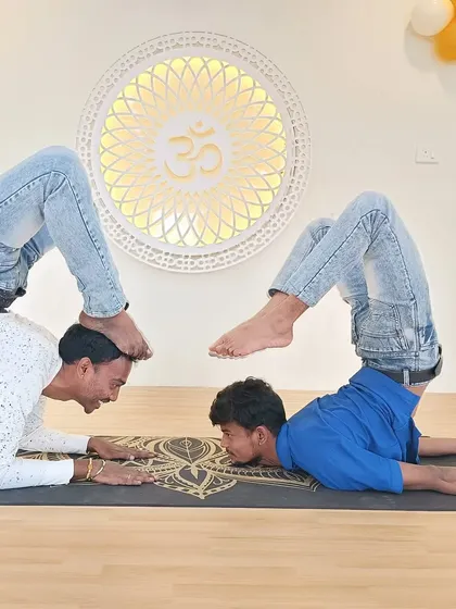 A creative and challenging partner inversion, demonstrating the trust and strength our students build together.