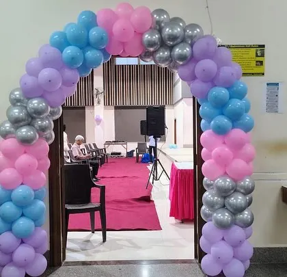 A beautiful balloon arch in pink, purple, blue, and silver created a magical entryway for the 'Frozen' themed birthday party.