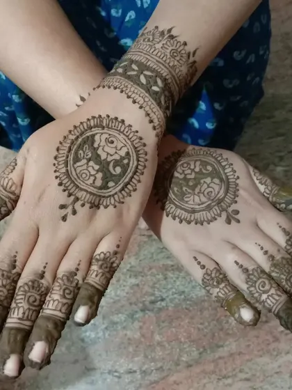 This is the back-of-hand view for a mandala design, featuring a unique pattern inside the circle. I always ensure the front and back designs complement each other.