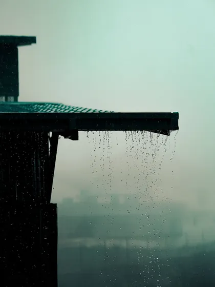 Rain dripping from a rooftop during the Mussoorie monsoon. I focus on small, poetic details like this to build a strong mood in my films.