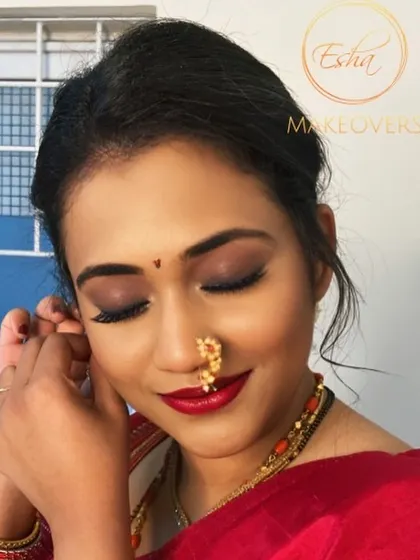 A classic combination of a smokey eye and a bold red lip. This timeless look is perfect for a traditional wedding ceremony and photographs beautifully.