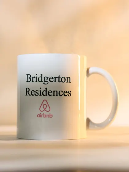 This custom-printed mug was made for a specific Airbnb property, "Bridgerton Residences," adding a highly personal and memorable touch to the gift.