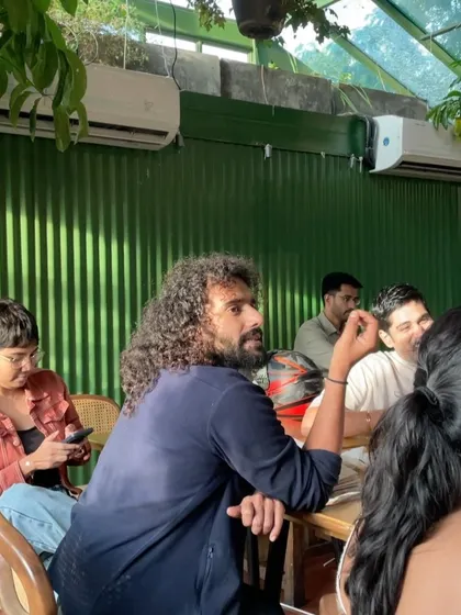 An engaged participant at our chocolate workshop. We encourage an interactive atmosphere where guests can chat with the experts and fellow attendees, making each session a communal experience.