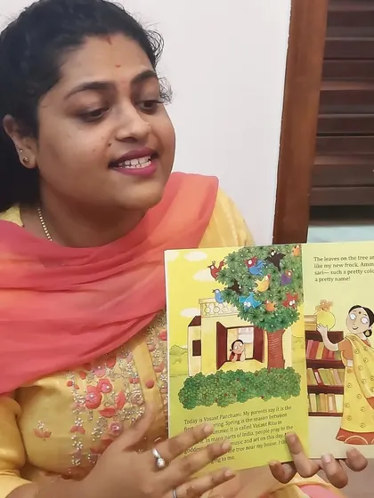 A teacher reads a story about spring to the children. Storytelling is a central part of our celebrations, making them educational and engaging.