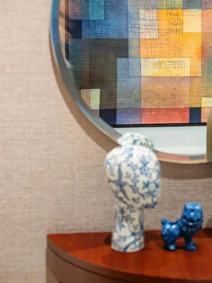 A detail shot of a console table with curated decor, reflecting the thoughtful styling in the Max128 apartment.