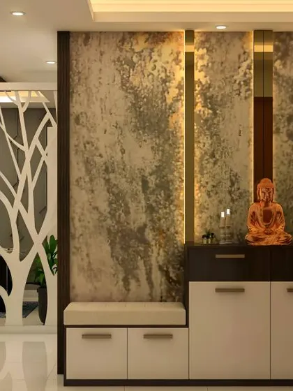 This foyer uses a tree-shaped partition to create a unique decorative feature. The design includes a bench and shoe cabinet, blending art with function.