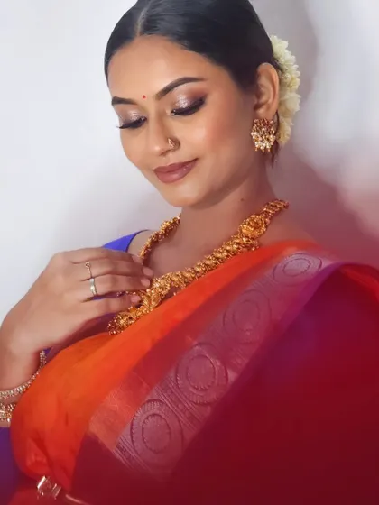 A close-up of my self-makeup look, showing the detailed eye makeup and the beautiful jewelry.