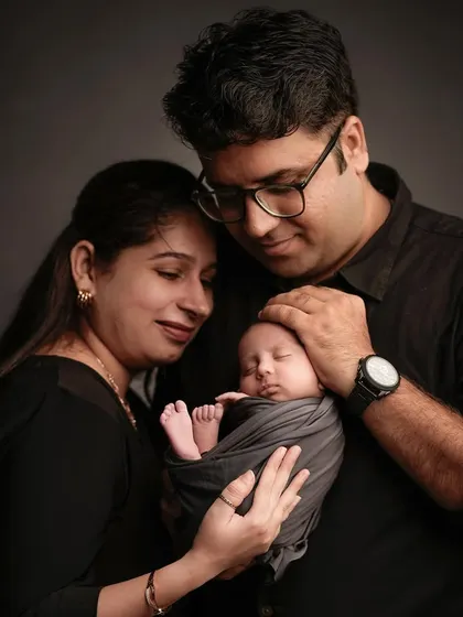 Those first few days are pure magic. We create a calm, quiet space in our studio for newborn family portraits, focusing on the tender connection between you and your new baby.