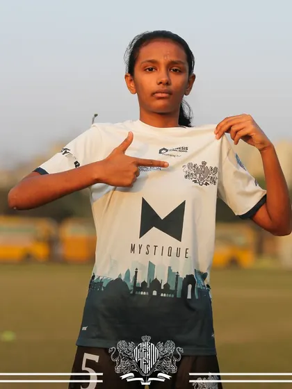 Pointing to the team logo, this player shows her pride in representing The Dream Team. Our custom jerseys are a symbol of our professional identity.
