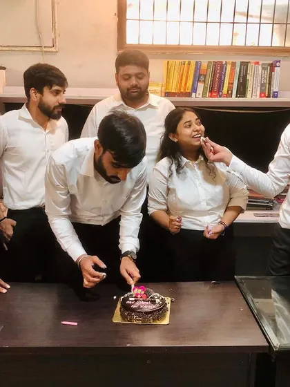 Sharing a moment of celebration during a team birthday at Nirwan Legal. A supportive team environment is key to our shared success.