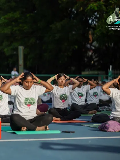 A moment of collective calm as participants practice Bhramari Pranayama (humming bee breath) together. This breathing technique is excellent for calming the mind and releasing tension.