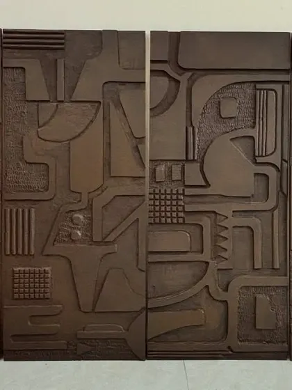 This set of four wooden art panels was a custom project for a home in Jaipur. Each panel features intricate, carved abstract patterns, creating a cohesive and sophisticated gallery wall with a rustic, modern feel.