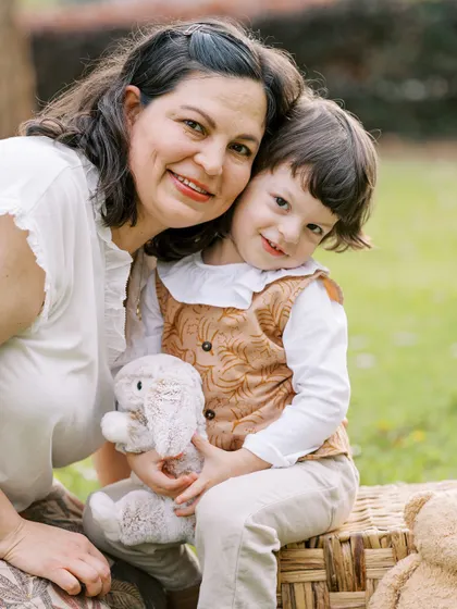 A mother holding her two-year-old son. The love and comfort in her embrace are clearly visible.