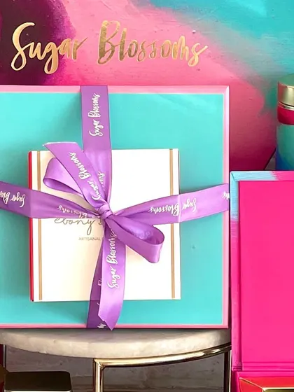 Another look at my festive packaging. I use a mix of vibrant colors like turquoise and magenta, finished with a luxurious satin ribbon.