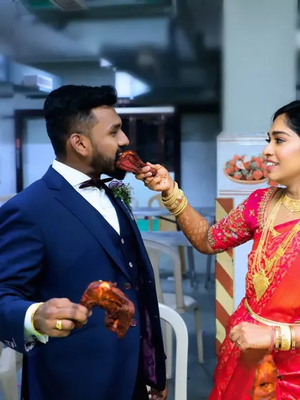 The bride playfully feeds the groom a piece of our delicious roasted chicken. These are the happy memories we help create.