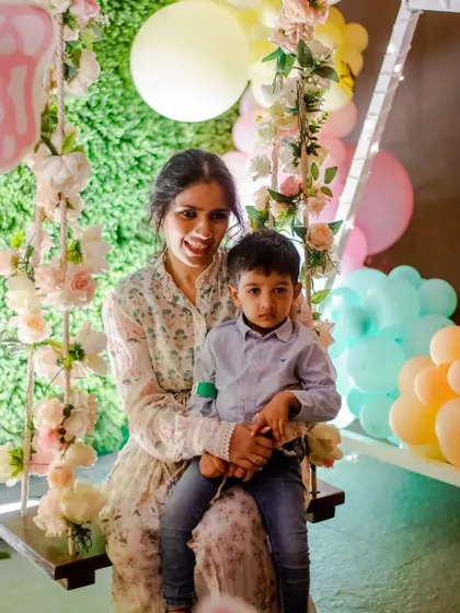 Another lovely photo of guests enjoying the floral swing.