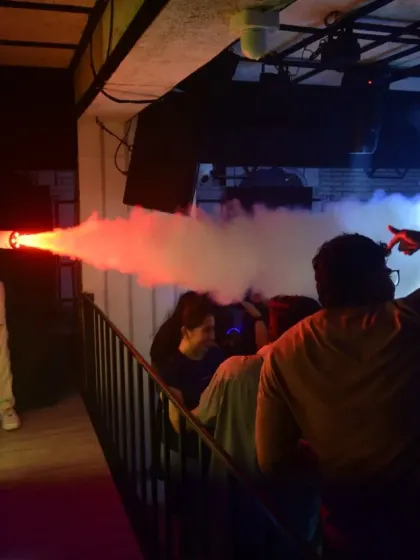 Using a CO2 cannon to hype up the crowd during a fan event. It's not just about the music; it's about creating a full-on show with special effects.