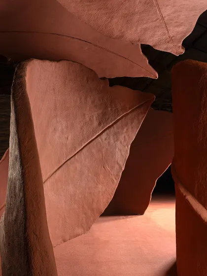 A repeat of image 72, showing a close-up view between the sculptural forms of the 'Terra' installation.