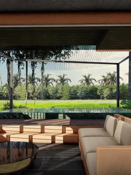 Our living spaces are designed to be open and fluid, connecting you directly with the outdoors. Here, the sunken lounge of our Corgao villa concept opens completely to the pool deck and the tropical greenery beyond, creating a seamless transition for a true indoor-outdoor lifestyle.