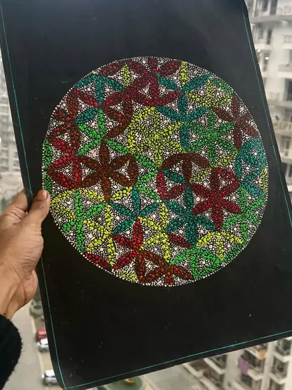 A geometric dot art piece with interlocking floral patterns. The use of red, green, and yellow creates a warm and energetic vibe.