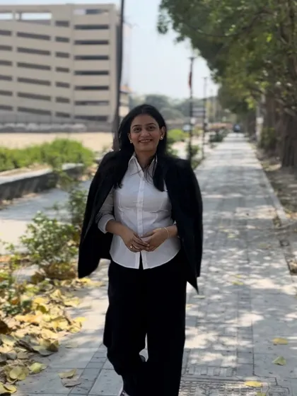 Walking on a path near the court, empowered and ready to litigate. My education and experience are the tools I use to serve justice.