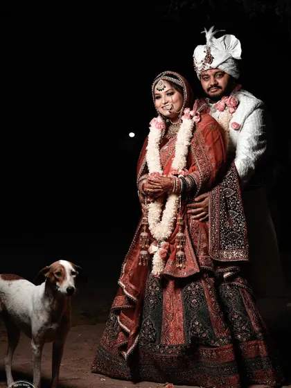 Sometimes the most unexpected moments make for the best memories. This unique wedding portrait includes a friendly stray dog who wandered into the frame, adding a touch of serendipity and charm to the shot.