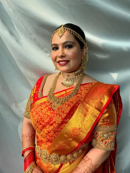 A classic portrait showcasing the traditional South Indian jewelry and the flawless makeup. The look is regal and sophisticated.