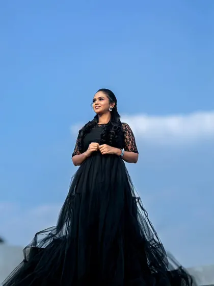 A powerful shot of our black gown against the sky. This dress is perfect for creating dramatic and memorable portraits.