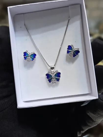 This butterfly pendant set in 925 silver has beautiful blue enamel work. It's a very popular design among our younger customers.