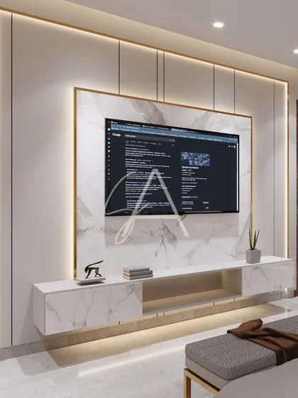 A close-up of the TV unit, where a slab of white marble is framed with gold-finished metal and soft backlighting. This is an example of how I use materials and light to create luxurious details.