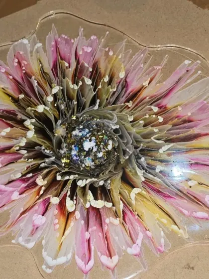 This intricate 3D flower with a sparkling center was made in my workshop. You can learn to create these detailed and beautiful floral pieces with my guidance.