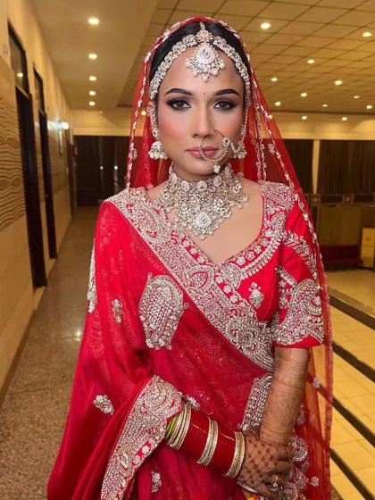 The same bridal look, but in a cooler, white light. This lighting brings out the true tones of the makeup and outfit, showing the versatility of the look.